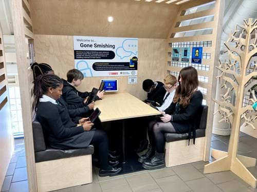 Teenagers playing Gone Smishing at the Dundee Science Centre